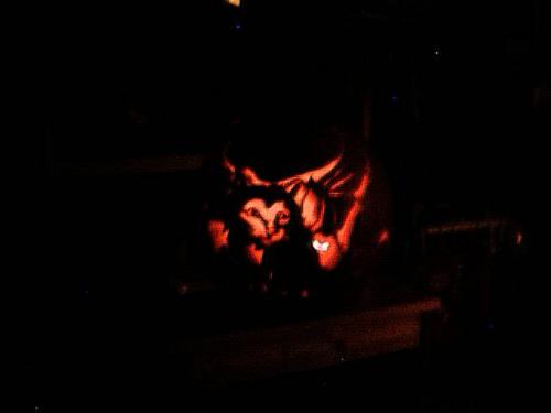 my halloween pumpkin that i carved. a puss with bat wings.