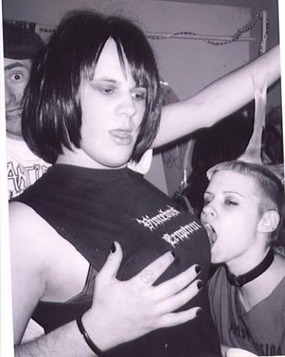 Here is a lovey pic of Mick, all dolled up and getting a boob bitten by a freakish TSS grrrl