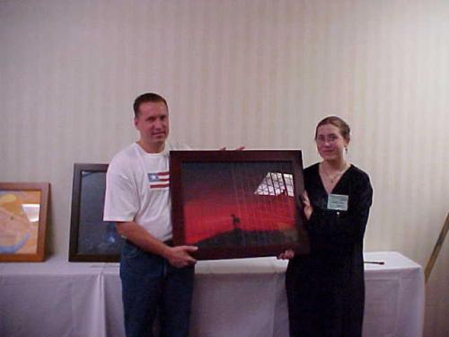 Yeah! I sold my first painting this weekend at Konniption (a gaming convention) for $150 and it was to the Guest of Honor, James Rollins (a best seller sci-fi author) Here is the picture I was able to get of him, me and the painting. (sorry about the glare on the glass in the painting) My year is made! :>