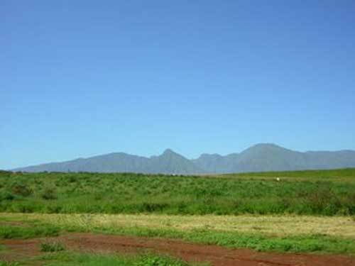 It's really hard to take a picture when riding in a car.  I hope I did the view some justice.  Oh yeah, and I just cleared up the picture a little bit so the mountains would be more clear so the clay is a smidge more red.