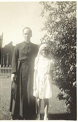 This was my grandmother when she was younger and her godfather.  I like his outfit. 
