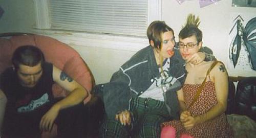 This is my friend  Walker and I at a TSS GRRL (Toxic shock syndrome) drag party, me in my new mohawk that wasnt put up...and walker in my dress...i was extremely intoxicated....my tounge is red from MD 20/20