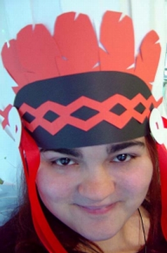 Me in my just made Native American headress, made entirely out of construction paper...I was so happy I wore it the rest of the day, and most of my coworkes thought I had gone mad.