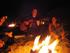 Devin's birthday party on the beach. Julia on the right and Rose and Jorgen's hands on the left. Ickgirl taking the picture, and MRD and Rayce on the other side of the fire