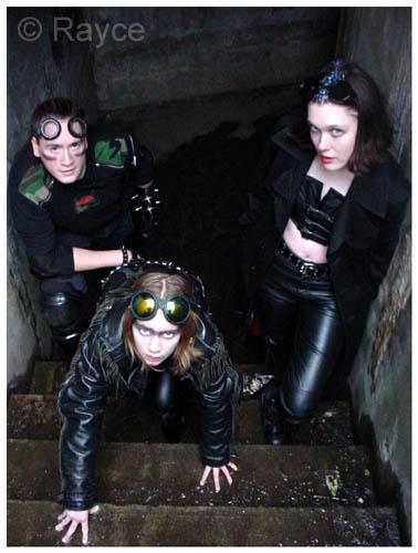 In comparison of the photo I took of my daughter at 8. Here is one taken on her 11th b-day during a co-shoot with Devin. My daughter is in the middle. She has spunk and I cannot keep her out of my cds! A goth girl in the making! On the left is Izzy and on the right is Megan. There is another of Megan in my nude gallery wearing a gas mask.