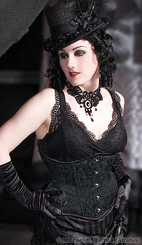 Finally a new pic!  It's a photo of me, modelling my own work - a black venise lace choker with black crystal accents and a feathered, flowered, lace-covered top hat. Corset by 'Starkers!'